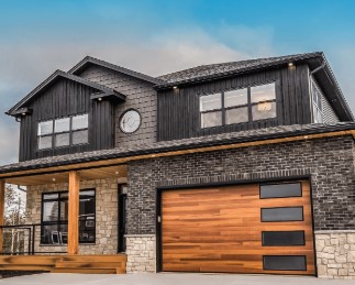 A contemporary garage door in wood and glass