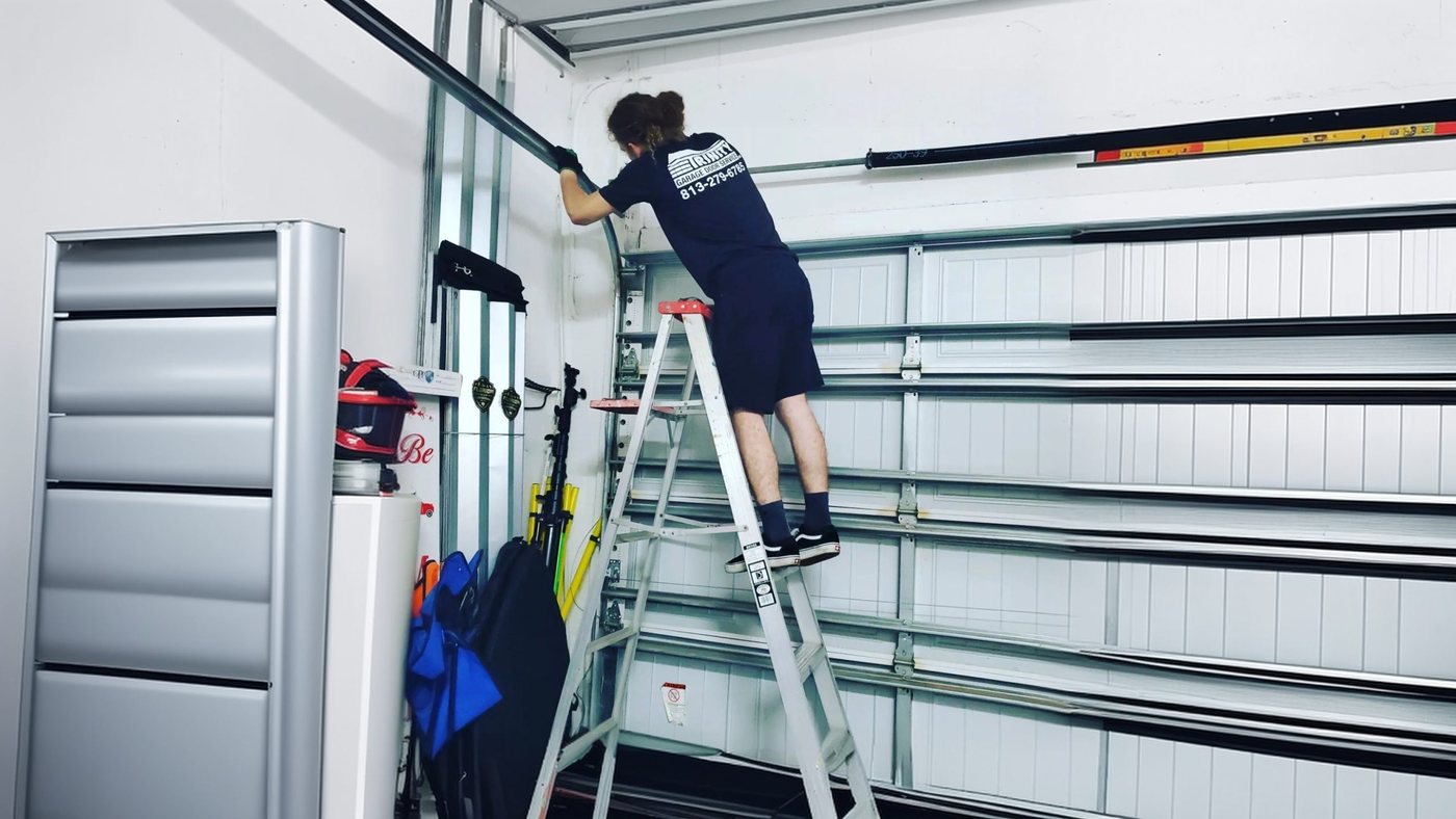 Trinity technicians tuning up a garage door