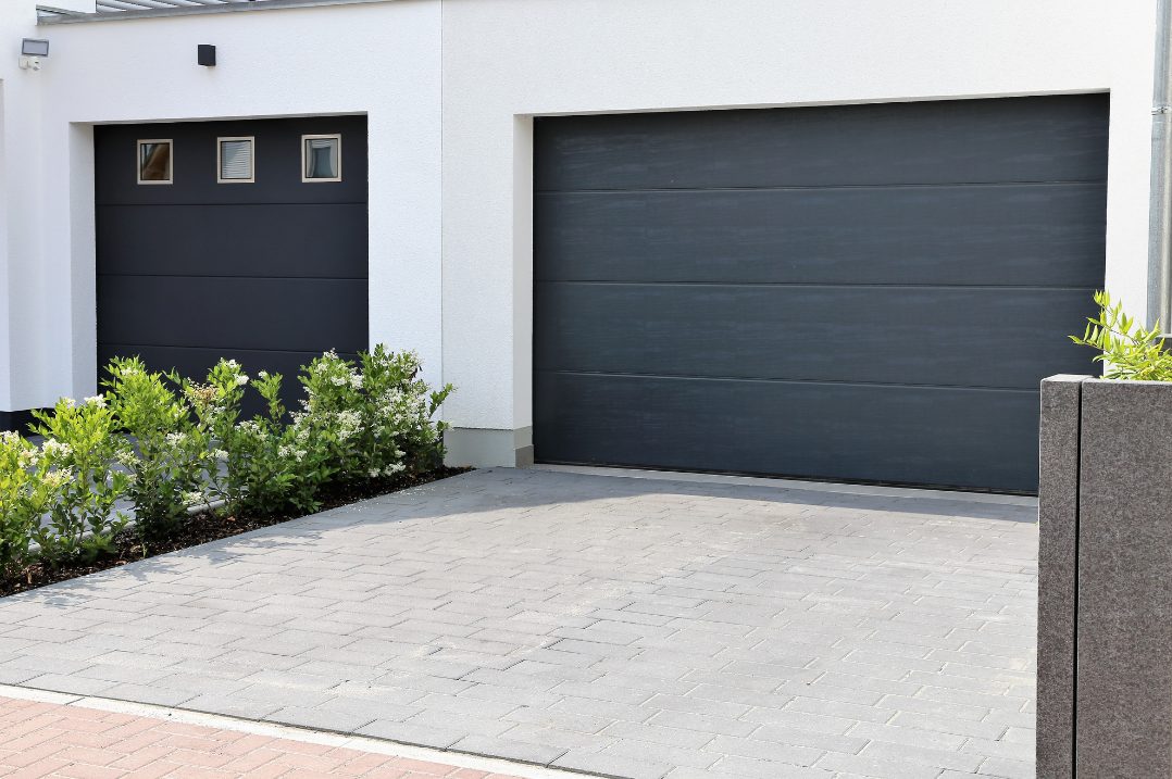A new carriage style garage door on a well kept home