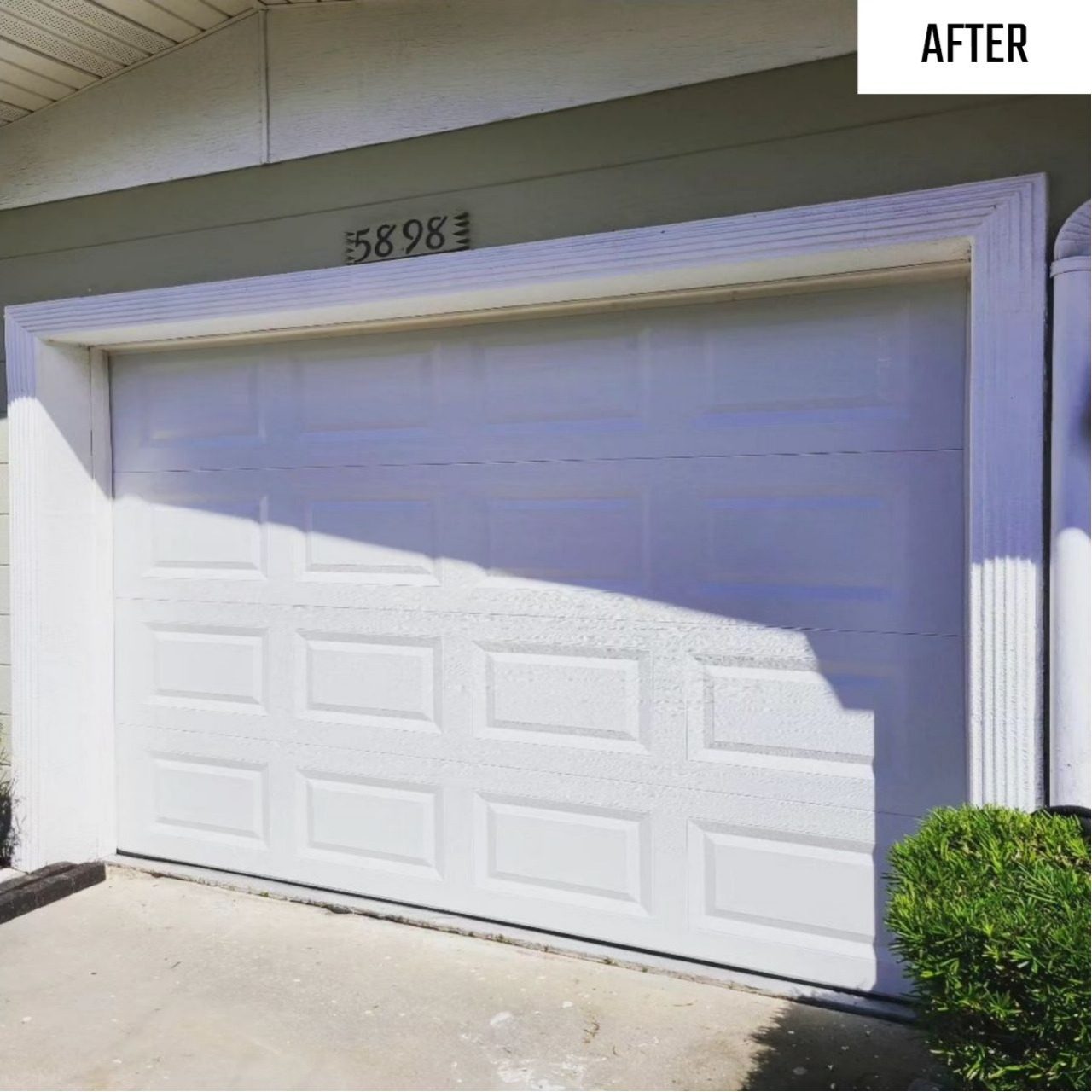 After: a dented garage door replaced with a straight new door